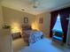 This comfortable bedroom features soft lighting, ceiling fan, and a large window for natural light at 13250 Meergate Cir, Orlando, FL 32837