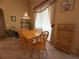 Cozy dining area with wood table and chairs, enhanced by natural light at 13250 Meergate Cir, Orlando, FL 32837