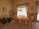 Cozy dining area with wood table and chairs, with decorative accents and neutral walls at 13250 Meergate Cir, Orlando, FL 32837