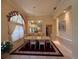 Formal dining room with large table, six chairs, elegant lighting, and decorative mirror at 13250 Meergate Cir, Orlando, FL 32837