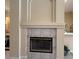 Traditional fireplace with decorative tile surround and neutral-colored mantle is the focal point at 13250 Meergate Cir, Orlando, FL 32837