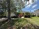 Lush landscaping frames this well-maintained home with a welcoming entrance at 13250 Meergate Cir, Orlando, FL 32837