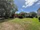 Attractive home featuring a manicured lawn and mature trees at 13250 Meergate Cir, Orlando, FL 32837