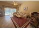 Inviting living room area with pool view, high ceilings, neutral decor, and comfortable seating at 13250 Meergate Cir, Orlando, FL 32837
