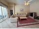 Comfortable living room with high ceilings, neutral decor, and access to a patio at 13250 Meergate Cir, Orlando, FL 32837
