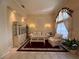 Comfortable living room with lots of natural light, lovely furniture, and a decorative display case at 13250 Meergate Cir, Orlando, FL 32837