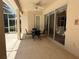 Covered outdoor patio area with a table and chairs at 13250 Meergate Cir, Orlando, FL 32837