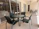 Covered outdoor patio featuring a table and chair set at 13250 Meergate Cir, Orlando, FL 32837