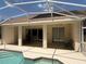 Covered patio area with ceiling fans overlooking the pool at 13250 Meergate Cir, Orlando, FL 32837