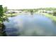 Community pond with a fountain and beautiful homes in the background at 13250 Meergate Cir, Orlando, FL 32837