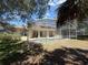 Backyard view of screened-in pool and patio area at 13250 Meergate Cir, Orlando, FL 32837
