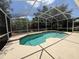 Screened-in pool area featuring a refreshing pool and spacious patio at 13250 Meergate Cir, Orlando, FL 32837