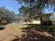 Large backyard featuring a screened-in pool and patio at 13250 Meergate Cir, Orlando, FL 32837