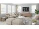 Bright and airy living room with large windows and comfortable seating area with stylish decor at 13271 Pergola Ave, Orlando, FL 32832