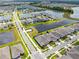 An aerial view of single-Gathering homes with a lake, showcasing their close proximity to green spaces at 13807 Tybee Beach Ln, Orlando, FL 32827