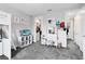 Spacious bedroom with closet and vanity with natural light and gray carpet at 13807 Tybee Beach Ln, Orlando, FL 32827