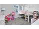 Fun bedroom with a loft bed, slide, playhouse, and plush carpet at 13807 Tybee Beach Ln, Orlando, FL 32827