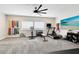 Spacious home gym with treadmill, free weights, and a TV for entertainment during workouts at 13807 Tybee Beach Ln, Orlando, FL 32827