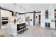 Modern kitchen featuring white cabinets, stainless steel appliances, island with seating, and open layout at 13807 Tybee Beach Ln, Orlando, FL 32827