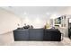 Large living room with a comfortable gray sectional sofa and built-in cabinets at 13807 Tybee Beach Ln, Orlando, FL 32827