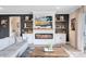 Stylish living room featuring a modern fireplace with built-ins, floating shelves, and comfortable seating at 13807 Tybee Beach Ln, Orlando, FL 32827