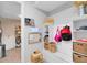 Organized mudroom with built-in bench, storage cubbies, and modern decor at 13807 Tybee Beach Ln, Orlando, FL 32827
