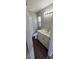 Bathroom with modern vanity and hardware, wood-look floors, and neutral walls at 159 Piccolo Way, Davenport, FL 33896