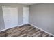 Bedroom featuring wood-look floors and neutral walls at 159 Piccolo Way, Davenport, FL 33896