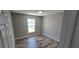 Bedroom featuring wood-look floors and neutral walls at 159 Piccolo Way, Davenport, FL 33896