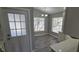 Cozy dining area flooded with natural light, featuring updated flooring and elegant chandelier at 159 Piccolo Way, Davenport, FL 33896