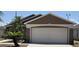 Beautiful house showing two car garage, lovely brown paint job, and a well-manicured lawn at 159 Piccolo Way, Davenport, FL 33896