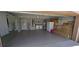 Garage features epoxy flooring, with washer/dryer hookups, and space for storage at 159 Piccolo Way, Davenport, FL 33896