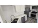 Well-equipped kitchen featuring modern cabinets, stainless steel appliances, and ample counter space at 159 Piccolo Way, Davenport, FL 33896