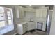 Updated kitchen showcasing modern white cabinets, sleek countertops, and stainless steel appliances at 159 Piccolo Way, Davenport, FL 33896