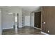 Bright living area boasts updated flooring and neutral paint, with built-in shelving adding character at 159 Piccolo Way, Davenport, FL 33896