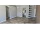 Open-concept room with lots of natural light and view into kitchen. Luxury vinyl flooring throughout at 159 Piccolo Way, Davenport, FL 33896