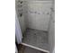Shower features grey tile with decorative accent border and built-in caddy at 159 Piccolo Way, Davenport, FL 33896