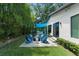 Spacious backyard with a patio, seating area, built-in grill, and privacy landscaping at 1624 E Livingston St, Orlando, FL 32803