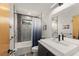 Modern bathroom featuring a sleek vanity, gray tiled shower, and contemporary fixtures at 1624 E Livingston St, Orlando, FL 32803