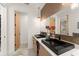 Stylish bathroom with dual sinks, modern fixtures, and a decorative mirror creating a functional space at 1624 E Livingston St, Orlando, FL 32803