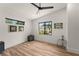 Minimalist bedroom with hardwood floors, recessed lighting, and contemporary artwork at 1624 E Livingston St, Orlando, FL 32803
