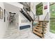 Elegant foyer with marble flooring, open staircase, and an abundance of natural light from large windows at 1624 E Livingston St, Orlando, FL 32803