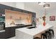 Contemporary kitchen showcasing custom cabinetry, stainless steel appliances, and a sleek design at 1624 E Livingston St, Orlando, FL 32803