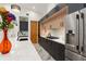 Spacious kitchen featuring modern cabinetry, stainless steel refrigerator, and marble floors at 1624 E Livingston St, Orlando, FL 32803