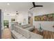 Bright living room with a modern wet bar, comfortable seating, and views of the outdoors at 1624 E Livingston St, Orlando, FL 32803