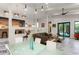 Bright and airy living room featuring modern decor, unique lighting, and seamless access to outdoor space at 1624 E Livingston St, Orlando, FL 32803