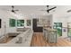 Open-concept living space with a wet bar, large windows, and a stylish sectional sofa at 1624 E Livingston St, Orlando, FL 32803