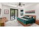Inviting main bedroom with a plush bed, outdoor views, and ample natural light with minimalist decor at 1624 E Livingston St, Orlando, FL 32803