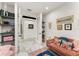 Cozy sitting room features stylish decor, ample shelving, and a comfortable sofa at 1624 E Livingston St, Orlando, FL 32803