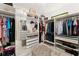 Organized walk-in closet with ample storage, custom shelving, and mirrored accents for a chic display at 1624 E Livingston St, Orlando, FL 32803